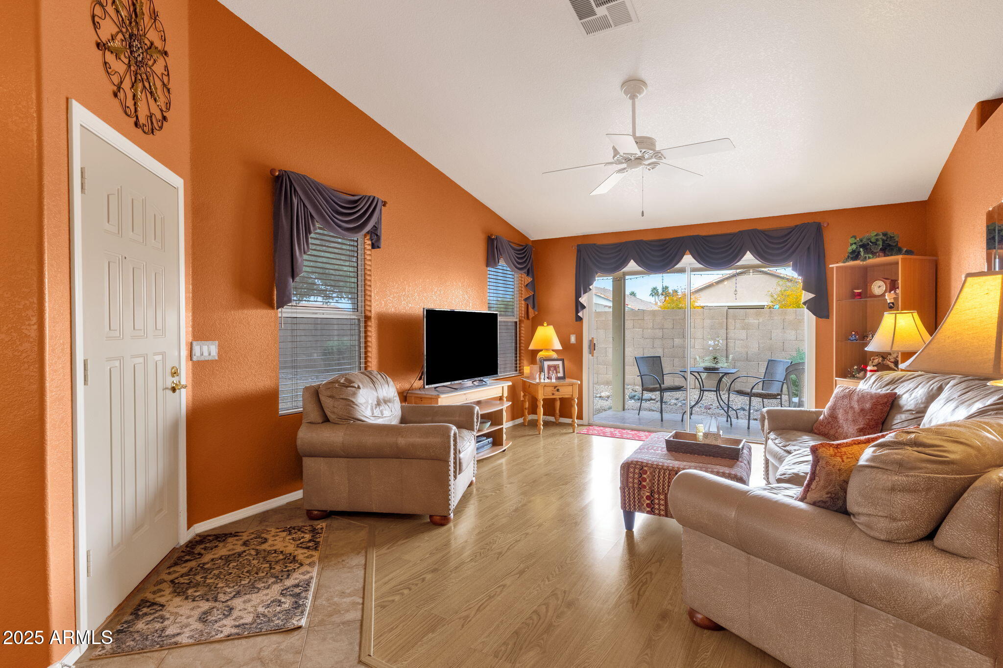 10408 West Burnett Road Peoria, AZ 85382 - Photo 9 of 30 a living room with furniture and a flat screen tv