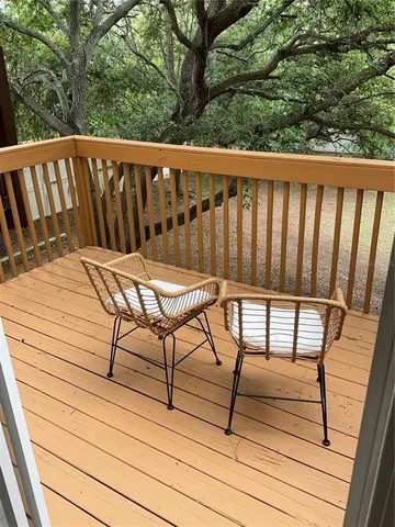 a view of a chairs on wooden deck