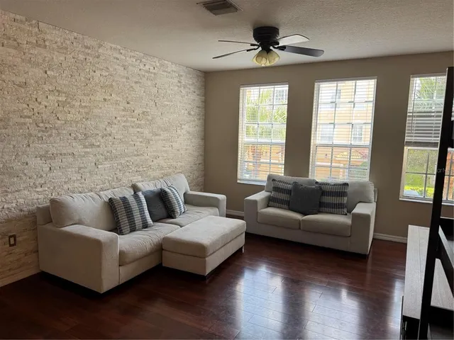 a living room with furniture and a window