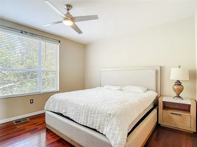 a bedroom with a bed and window