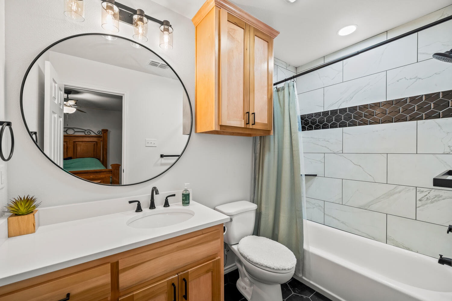 2605 Madison Street Lubbock, TX 79415 - Photo 15 of 23 a bathroom with a sink a toilet and shower