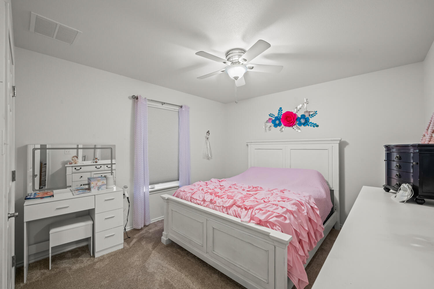 2605 Madison Street Lubbock, TX 79415 - Photo 17 of 23 a bedroom with a bed and a chandelier