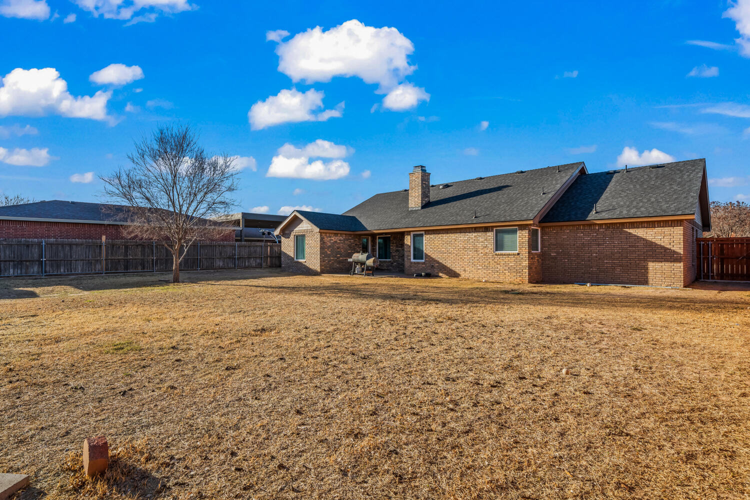 2605 Madison Street Lubbock, TX 79415 - Photo 23 of 23 a backyard of a house with lots of green space