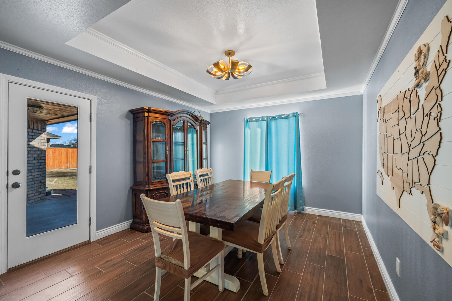 2605 Madison Street Lubbock, TX 79415 - Photo 8 of 23 a view of a dining room with furniture and wooden floor