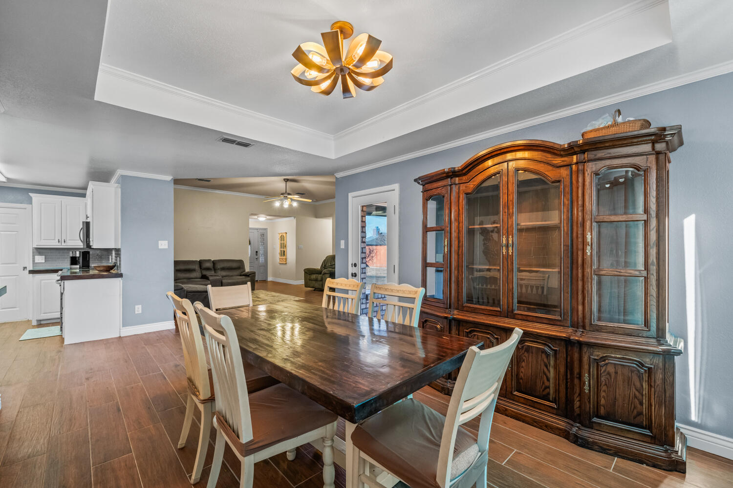 2605 Madison Street Lubbock, TX 79415 - Photo 9 of 23 a view of a dining room with furniture and wooden floor