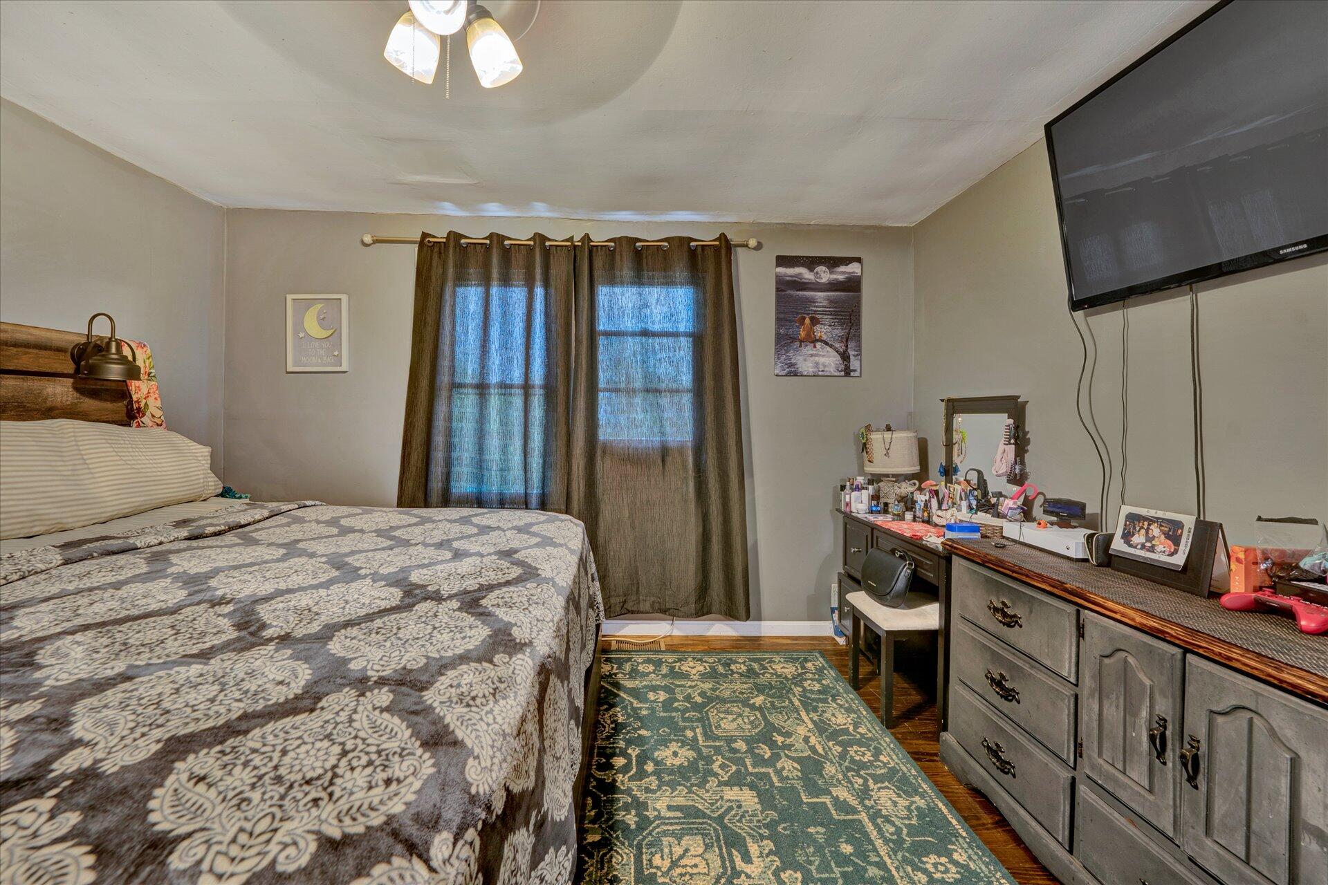 1344 Skyview Road Salem, VA 24153 - Photo 17 of 23 a bedroom with a bed and a dresser in it
