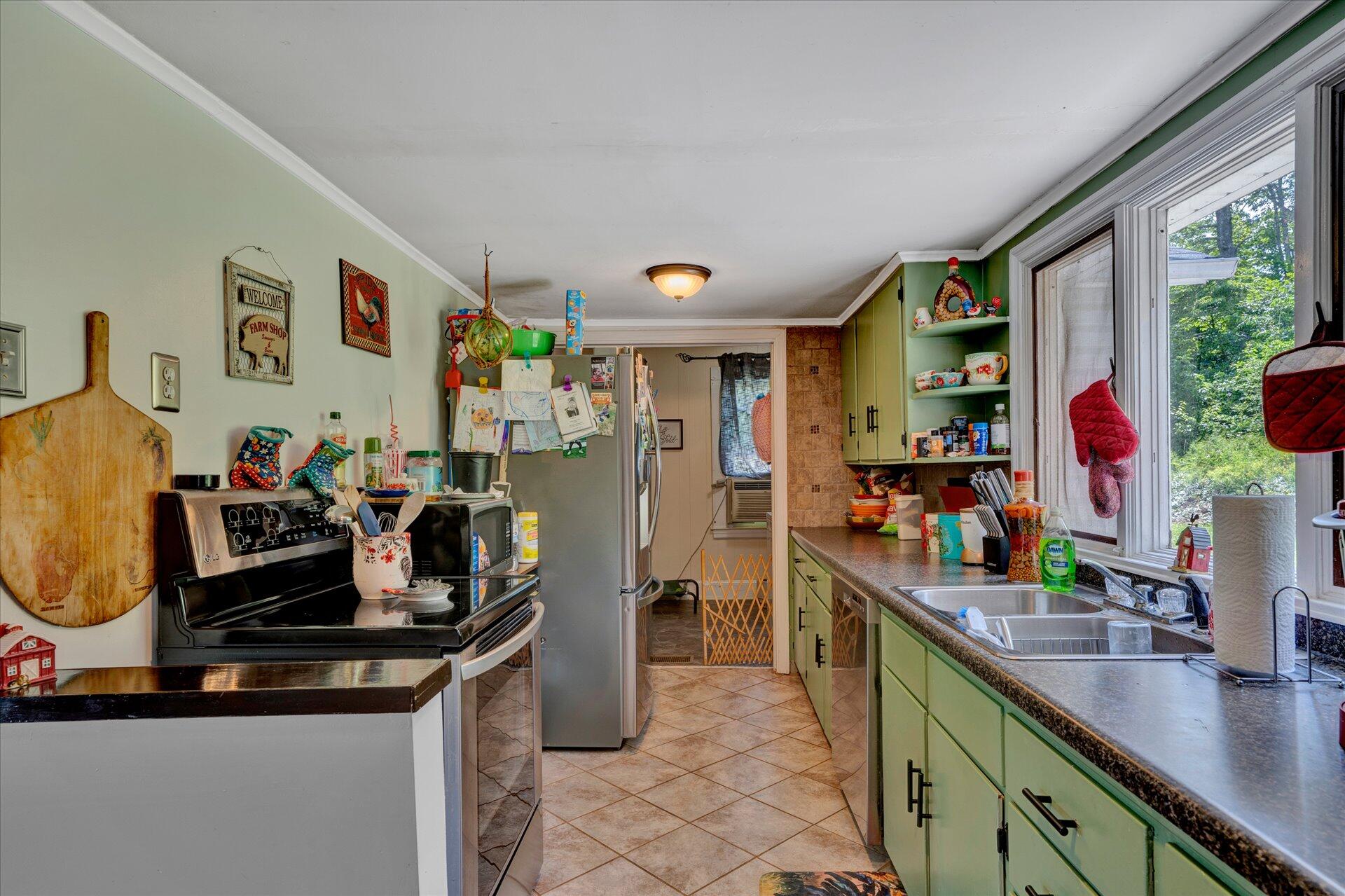 1344 Skyview Road Salem, VA 24153 - Photo 7 of 23 a kitchen with a sink and cabinets