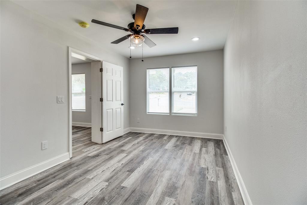 1201 Ridgewood Road Denison, TX 75020 - Photo 21 of 29 Spare room featuring ceiling fan and light hardwood / wood-style floors