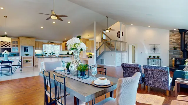 a dining room with furniture window and wooden floor