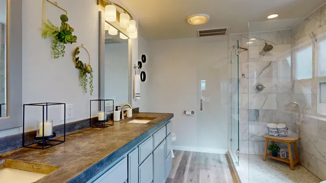 a view of a house with wooden fence