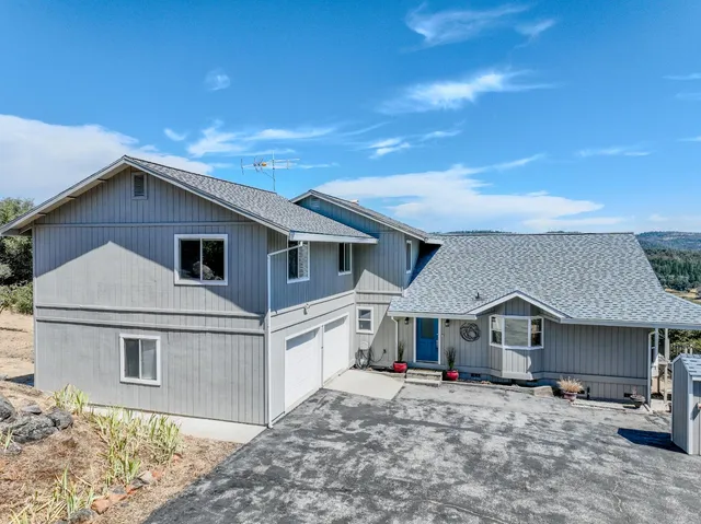 a dining room with furniture window and wooden floor