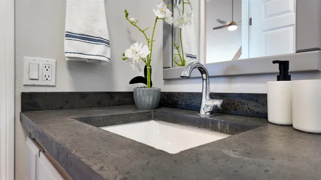 a utility room with cabinets washer and dryer