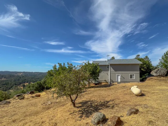 a house with trees in the background