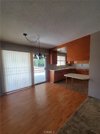 a view of a livingroom with furniture window and wooden floor
