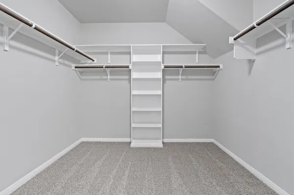 a view of an empty walk in closet