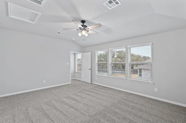 a view of an empty room with a window