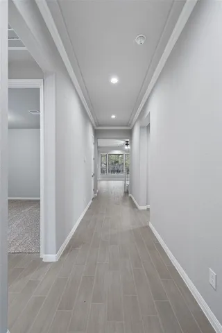 a large white kitchen with a large window appliances and cabinets