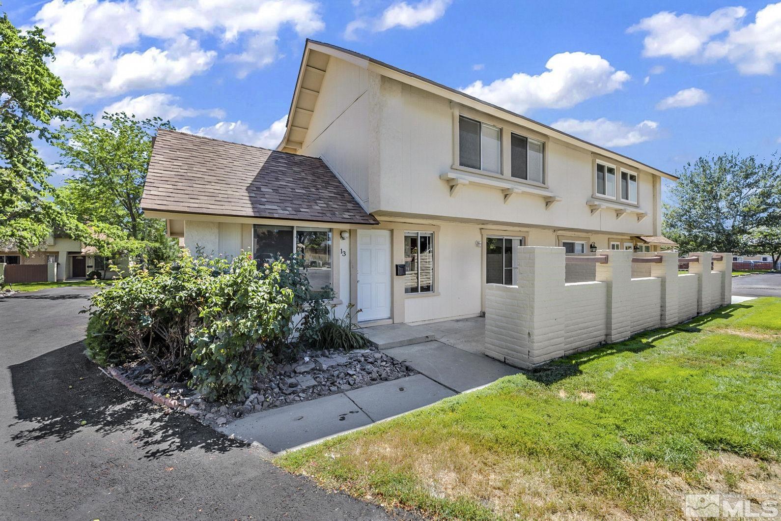 13 Condor Circle Carson City, NV 89701 - Photo 1 of 33 a front view of a house with garden