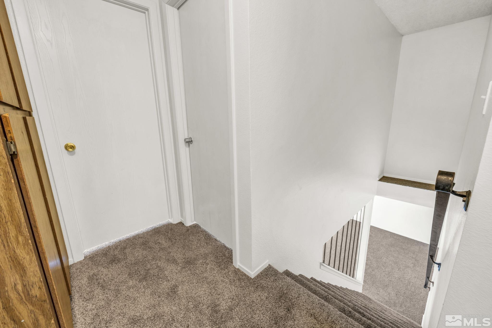 13 Condor Circle Carson City, NV 89701 - Photo 14 of 33 a view of a hallway with furniture and wooden floor