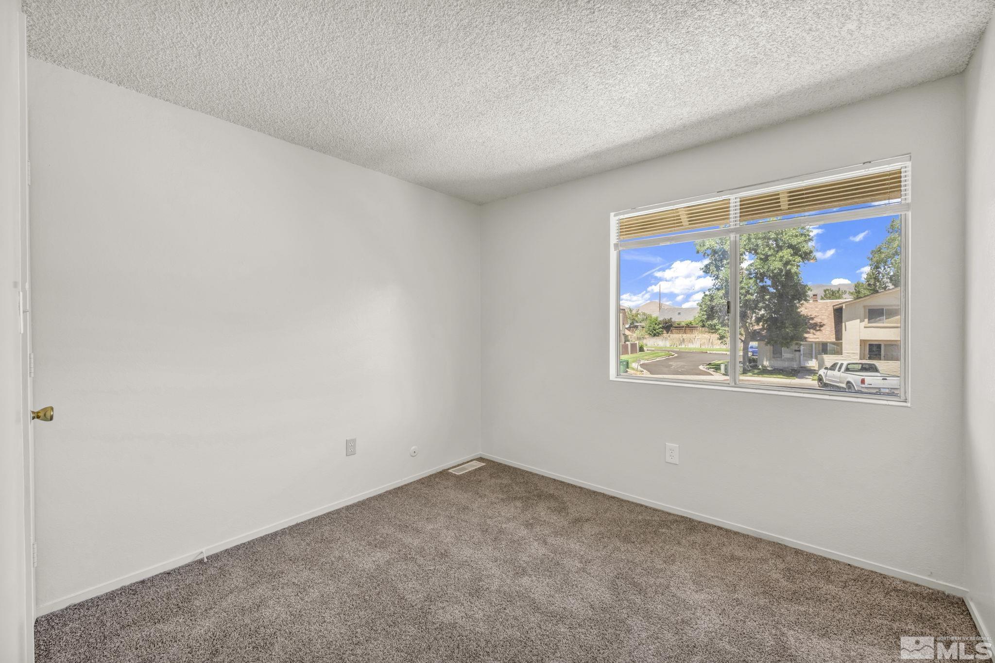 13 Condor Circle Carson City, NV 89701 - Photo 15 of 33 an empty room with windows