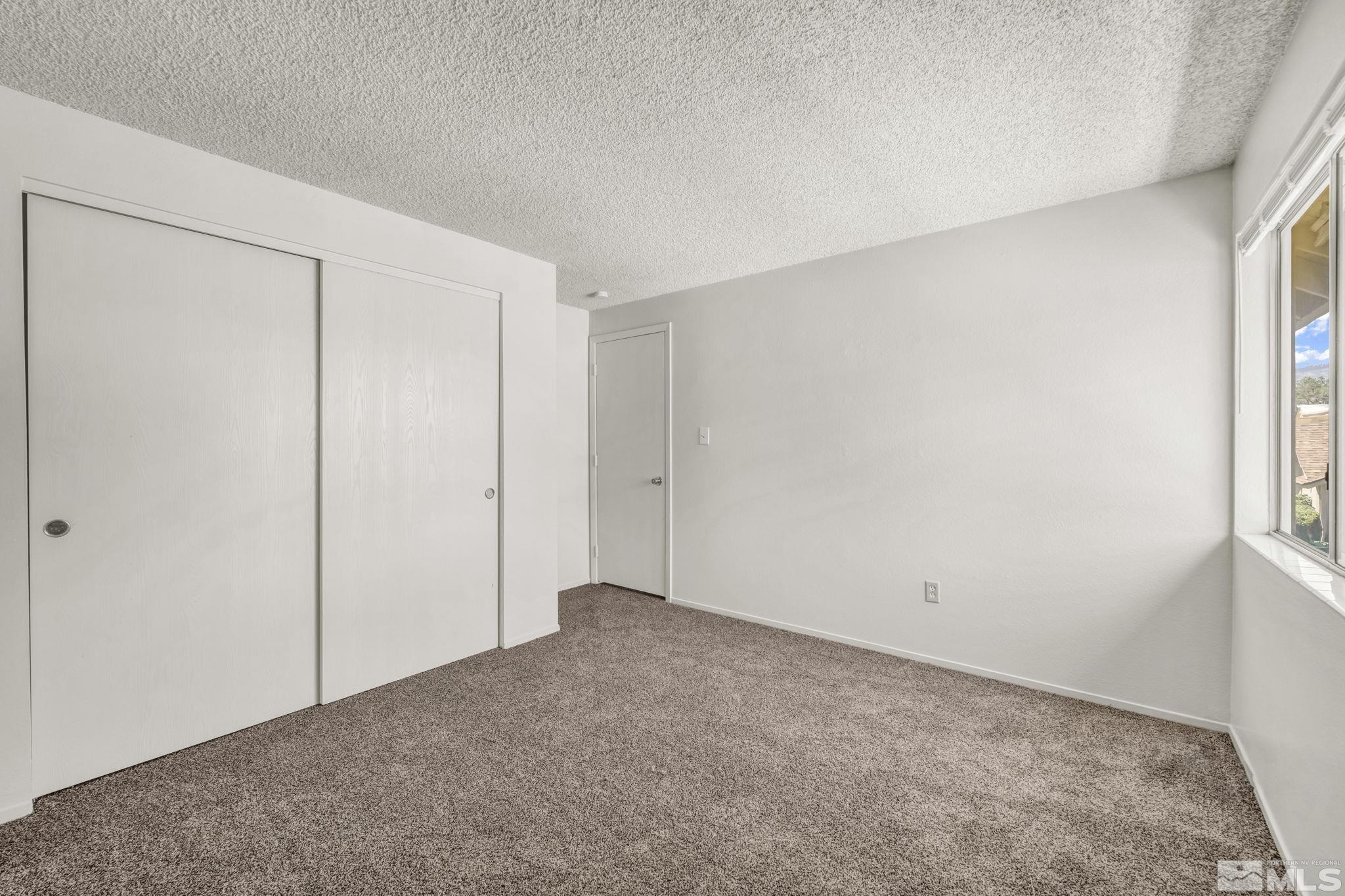 13 Condor Circle Carson City, NV 89701 - Photo 20 of 33 a view of an empty room and a window