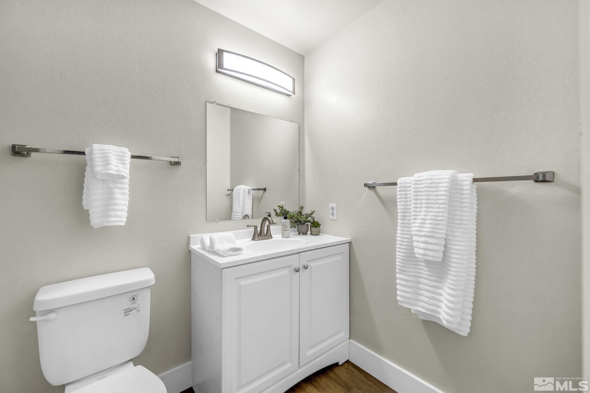 13 Condor Circle Carson City, NV 89701 - Photo 24 of 33 a bathroom with a toilet sink and mirror