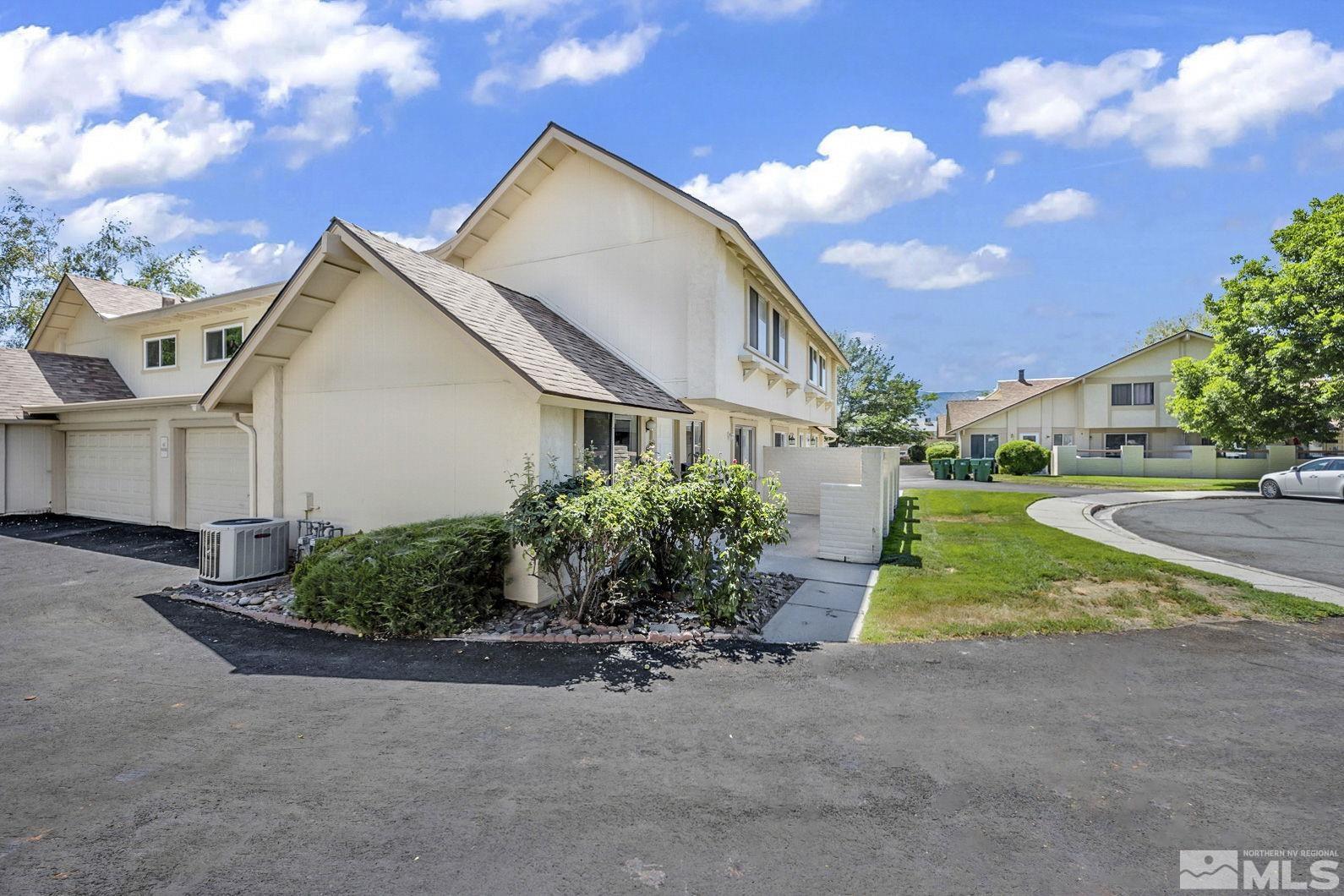 13 Condor Circle Carson City, NV 89701 - Photo 29 of 33 a front view of a house with a yard and garage