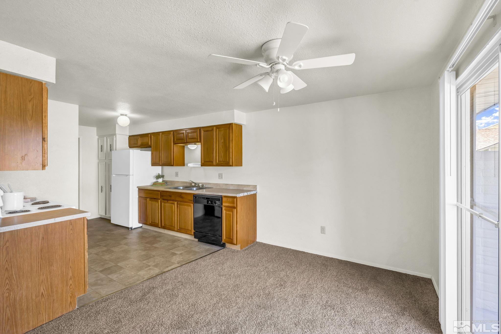 13 Condor Circle Carson City, NV 89701 - Photo 3 of 33 a view of a kitchen with a sink and a kitchen