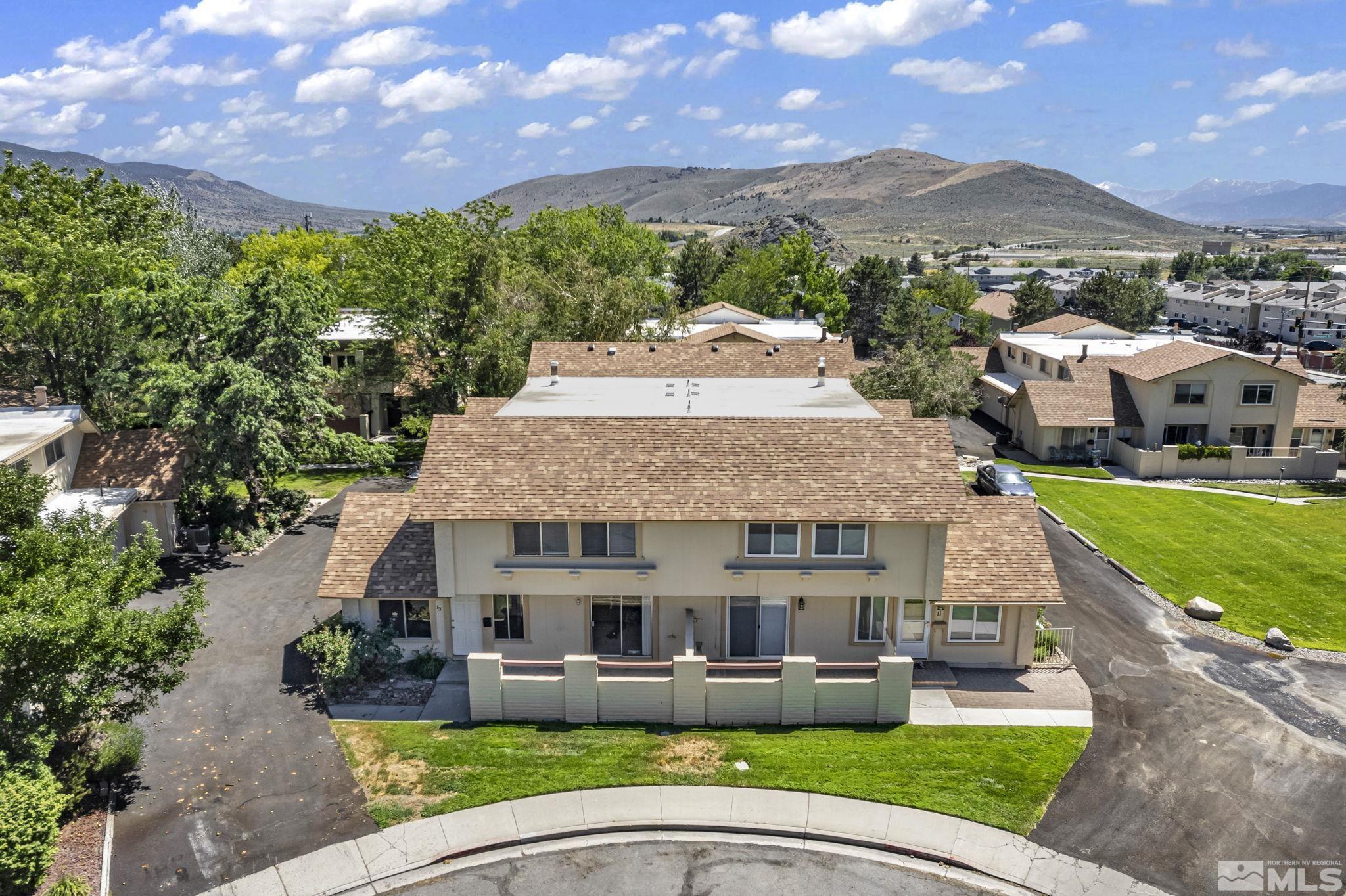 13 Condor Circle Carson City, NV 89701 - Photo 31 of 33 a aerial view of a house with a yard table and chairs