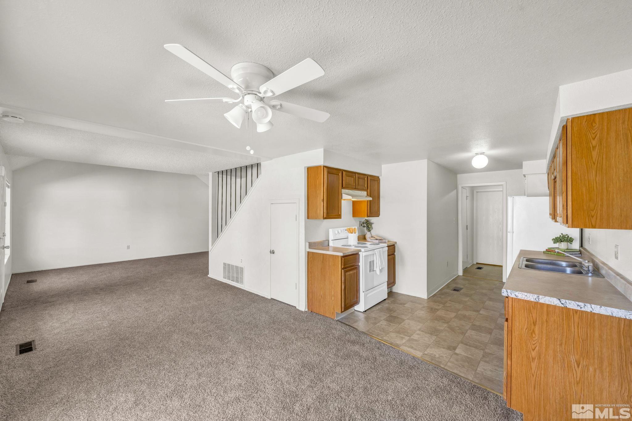 13 Condor Circle Carson City, NV 89701 - Photo 9 of 33 a view of a kitchen with a sink and a refrigerator