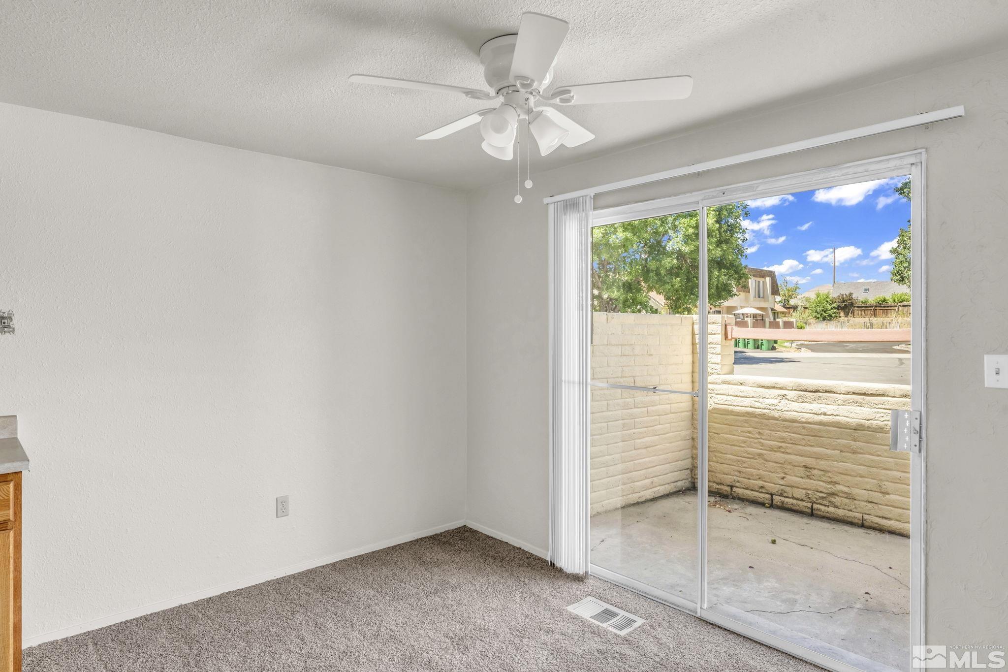 13 Condor Circle Carson City, NV 89701 - Photo 10 of 33 an empty room with windows and ceiling fan