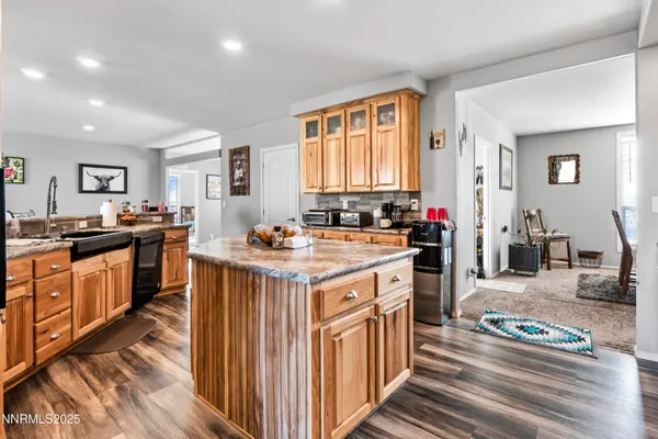 a kitchen with lots of counter top space and stainless steel appliances