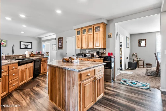 a kitchen with lots of counter top space and stainless steel appliances