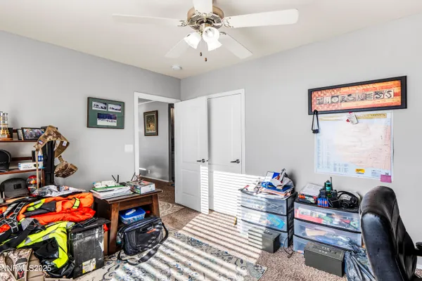 a bathroom with a granite countertop sink a toilet and shower