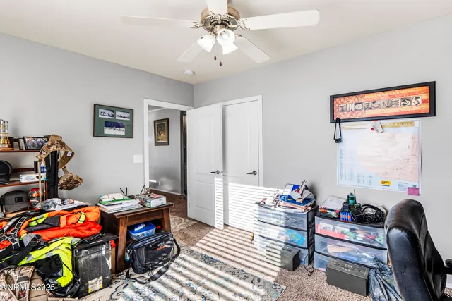 a bathroom with a granite countertop sink a toilet and shower