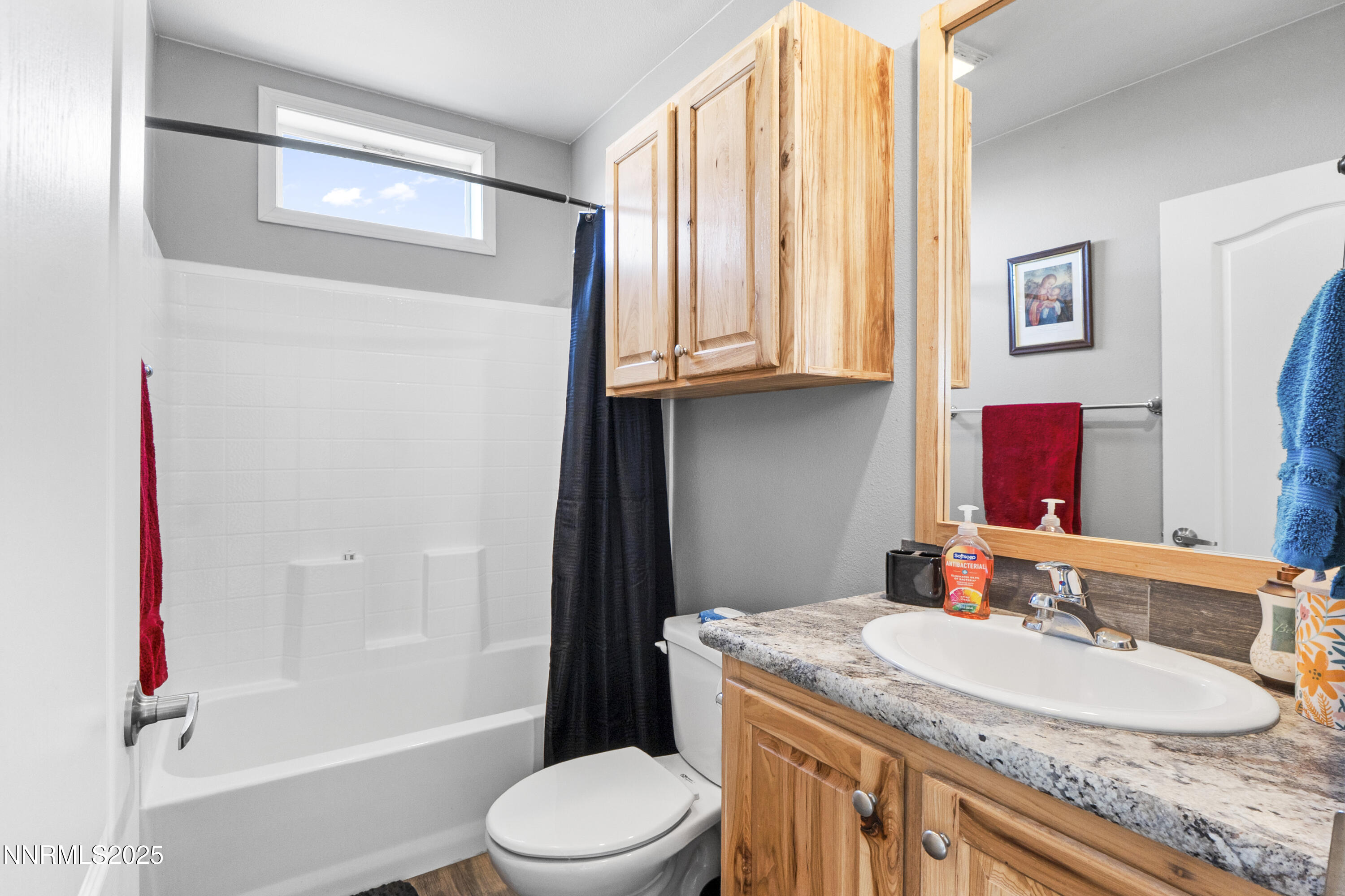 6745 Country Road Winnemucca, NV 89445 - Photo 16 of 50 a bathroom with a granite countertop sink a toilet and shower