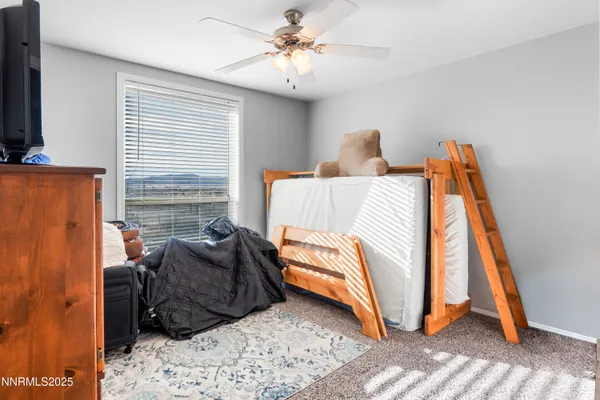 a bedroom with a bed and a table