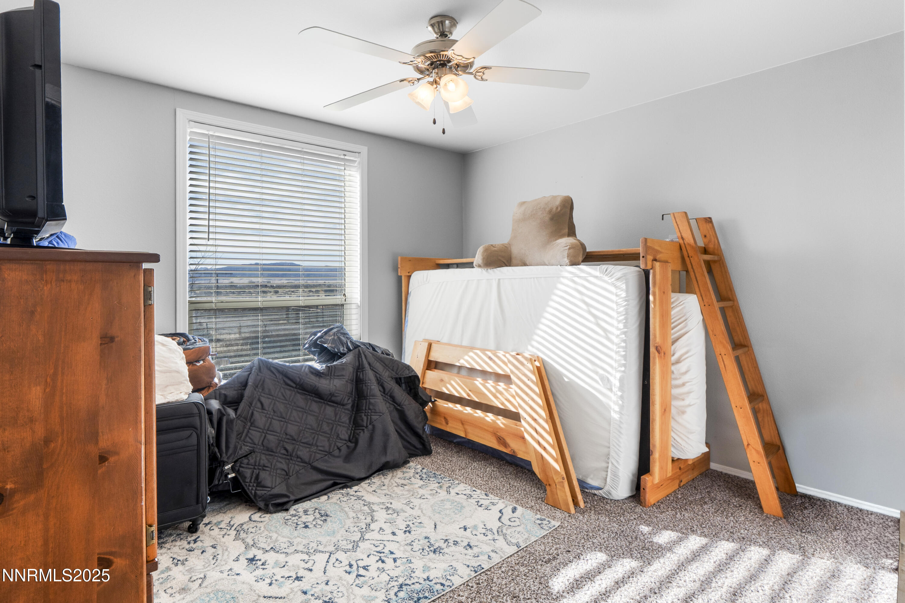 6745 Country Road Winnemucca, NV 89445 - Photo 17 of 50 a bedroom with a bed and a window