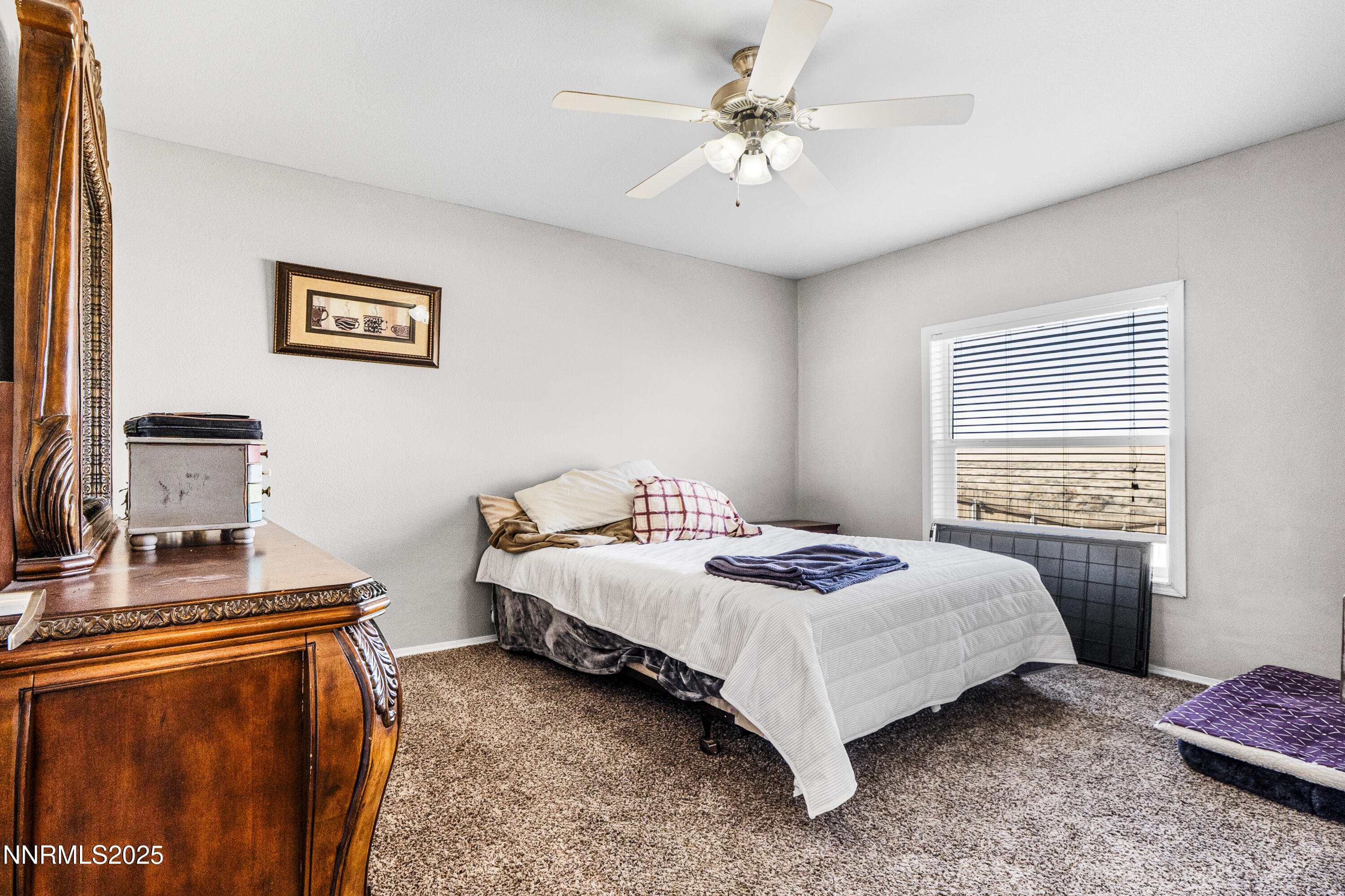 6745 Country Road Winnemucca, NV 89445 - Photo 18 of 50 a bedroom with a bed and a table