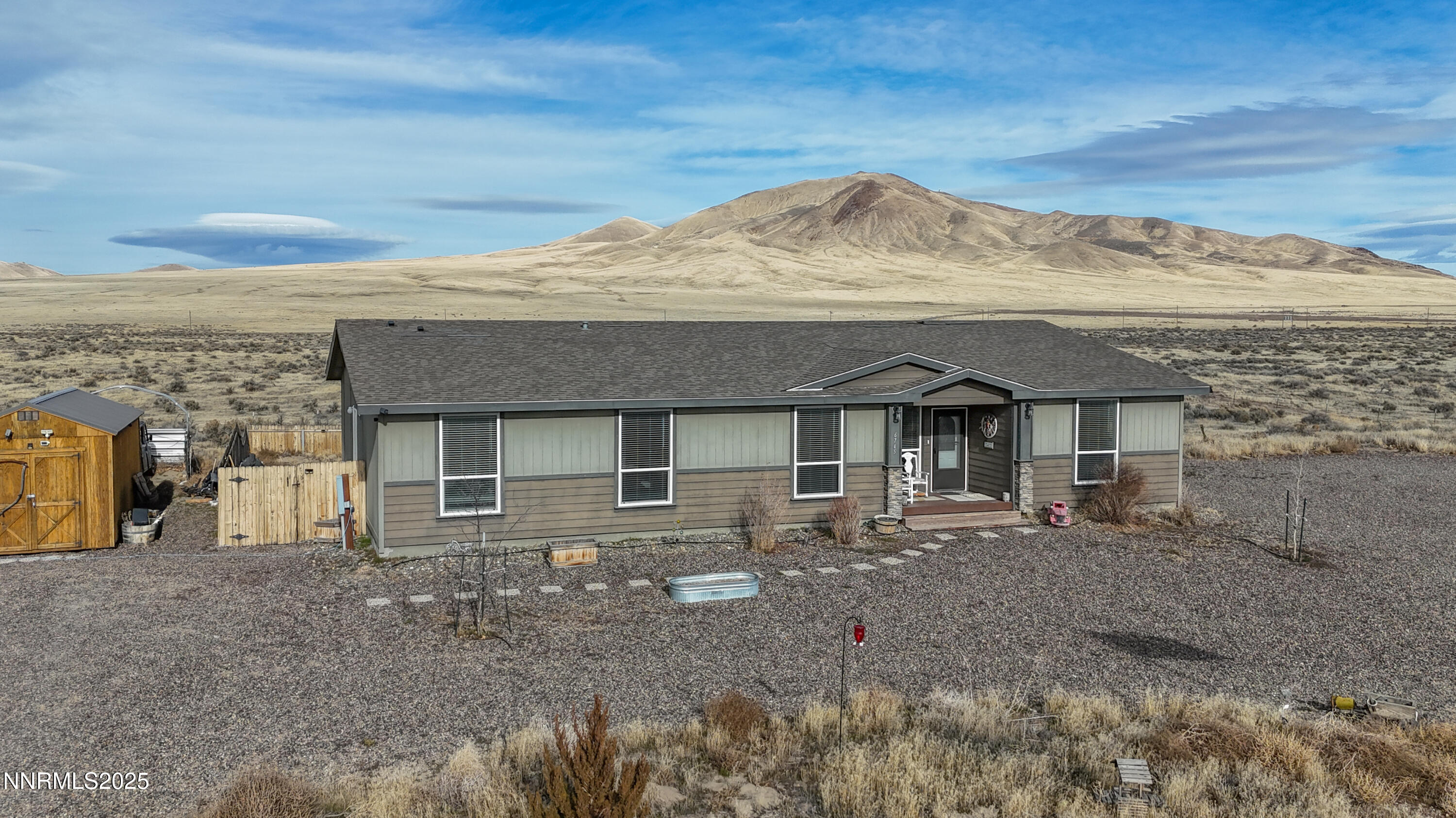 6745 Country Road Winnemucca, NV 89445 - Photo 2 of 50 a front view of a house with a yard