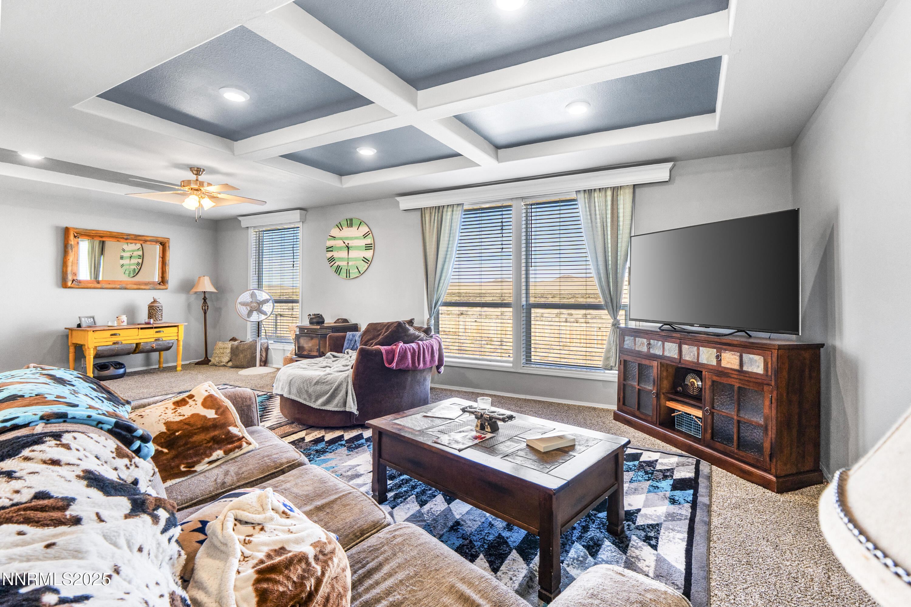 6745 Country Road Winnemucca, NV 89445 - Photo 24 of 50 a living room with furniture and a flat screen tv