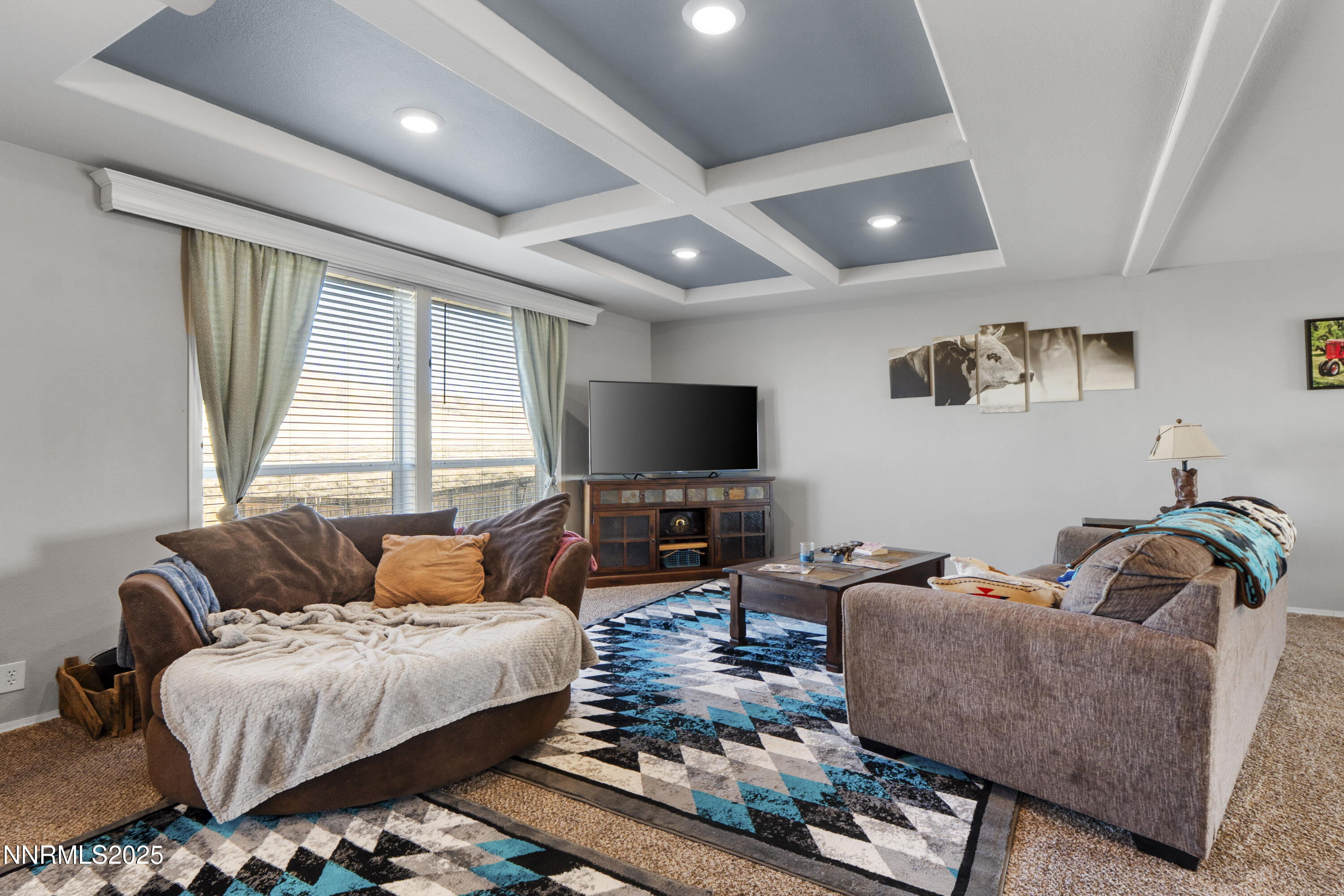 6745 Country Road Winnemucca, NV 89445 - Photo 26 of 50 a living room with furniture and a flat screen tv
