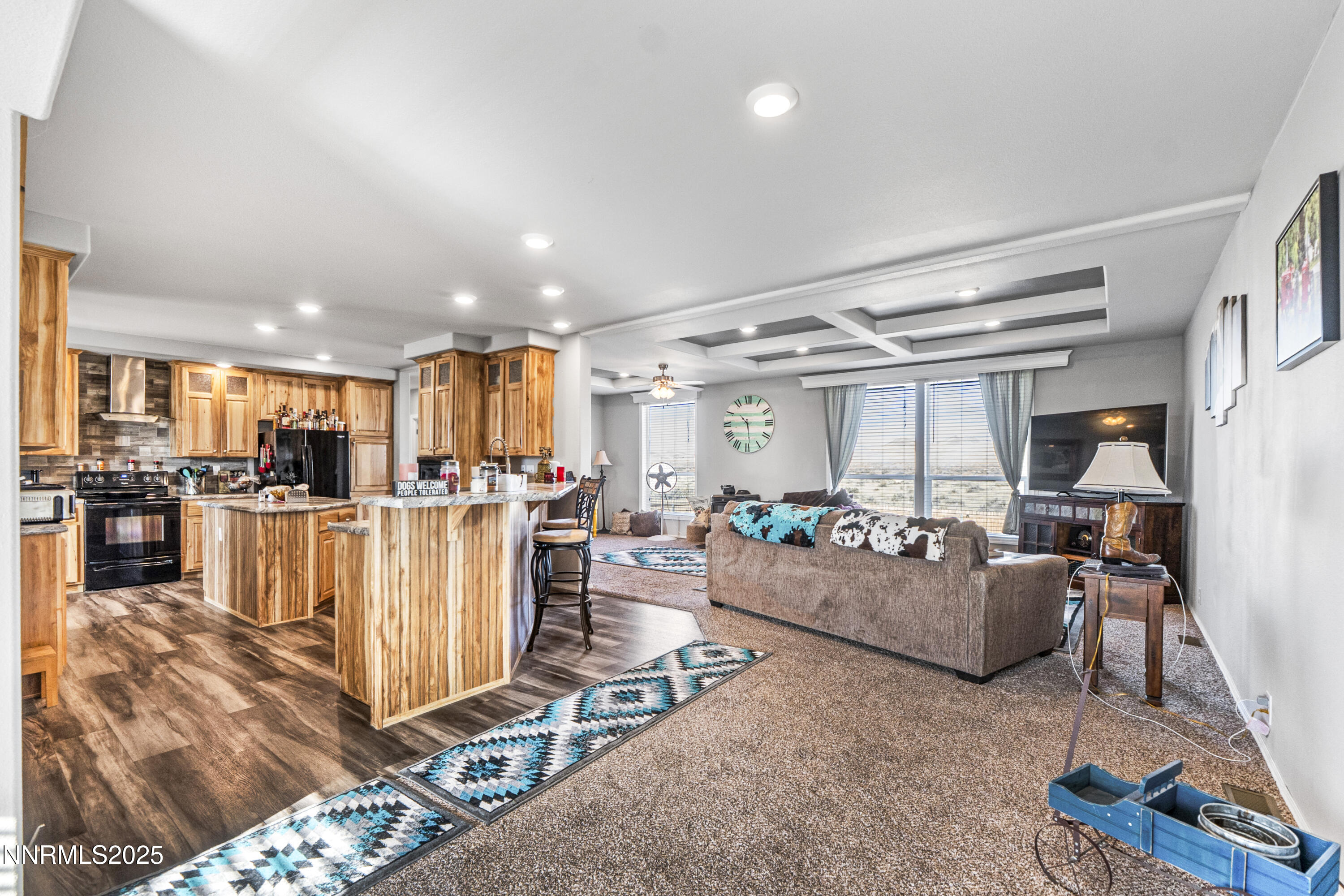 6745 Country Road Winnemucca, NV 89445 - Photo 31 of 50 a living room with furniture a kitchen view and a chandelier