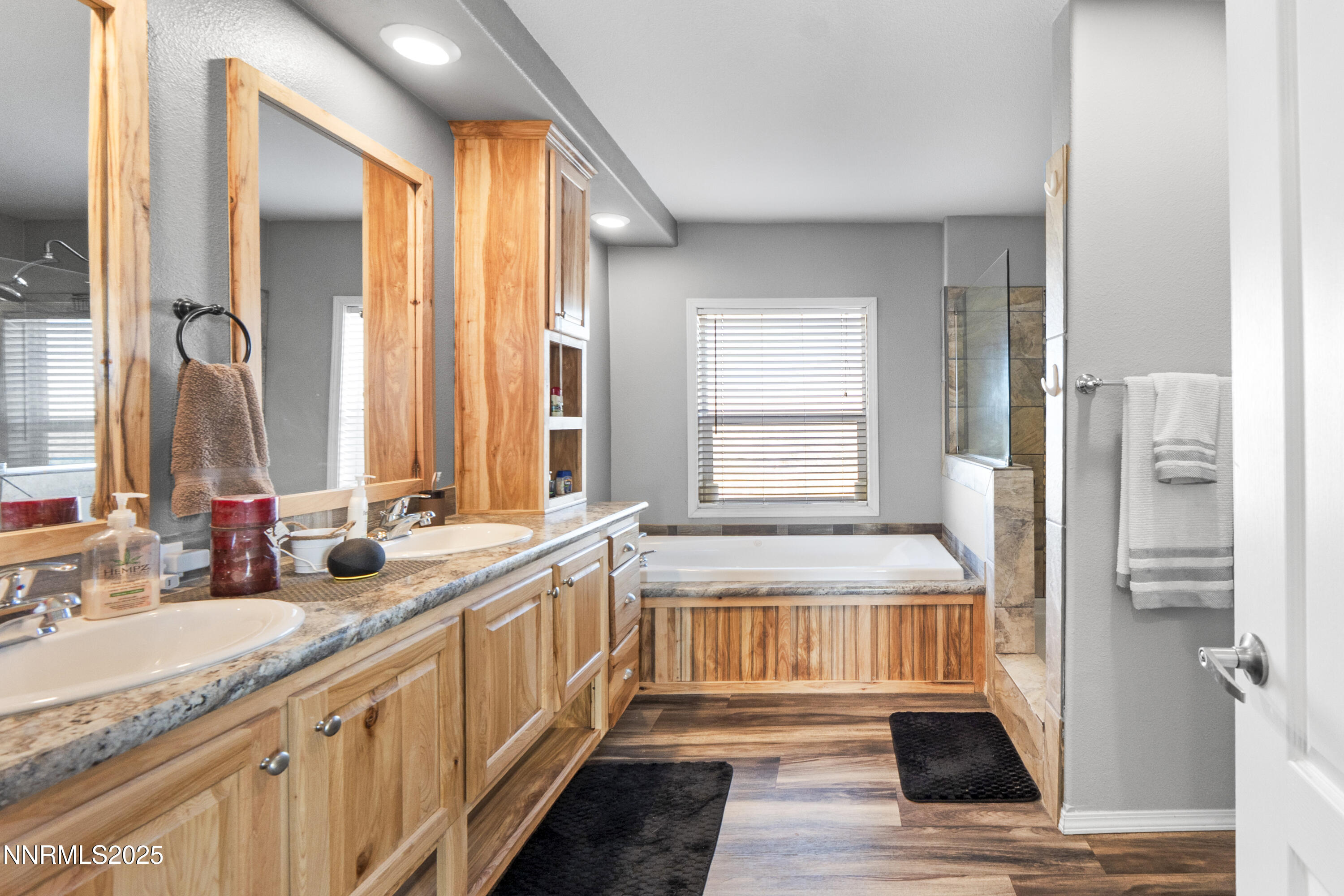6745 Country Road Winnemucca, NV 89445 - Photo 32 of 50 a bathroom with a granite countertop sink and a large mirror