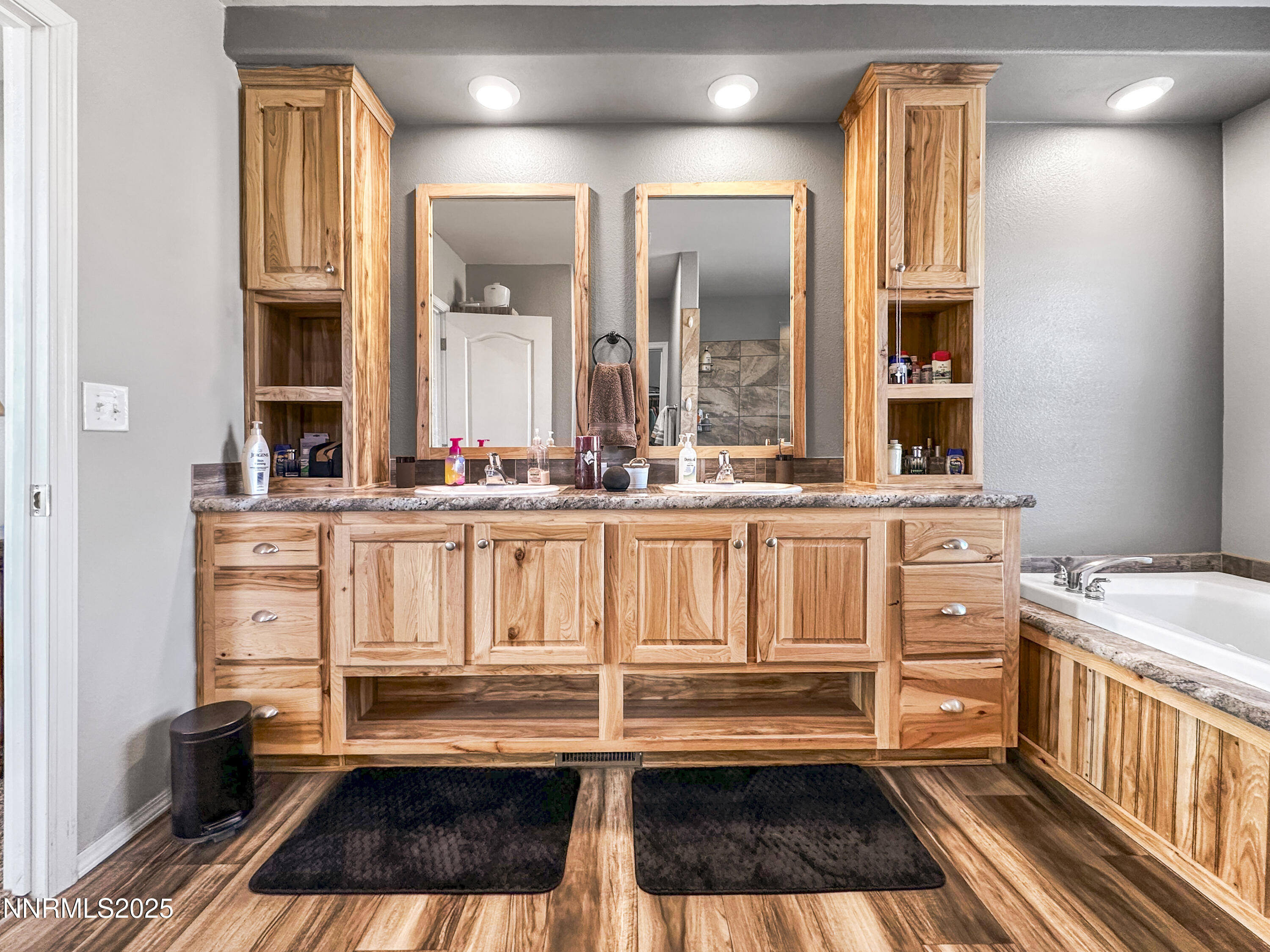6745 Country Road Winnemucca, NV 89445 - Photo 34 of 50 a bathroom with a granite countertop sink and a mirror