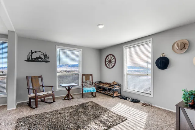 a bedroom with bed and a chandelier