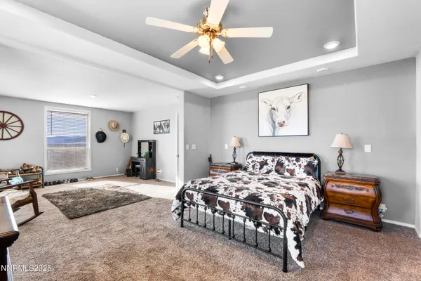 a bedroom with bed and flat screen tv