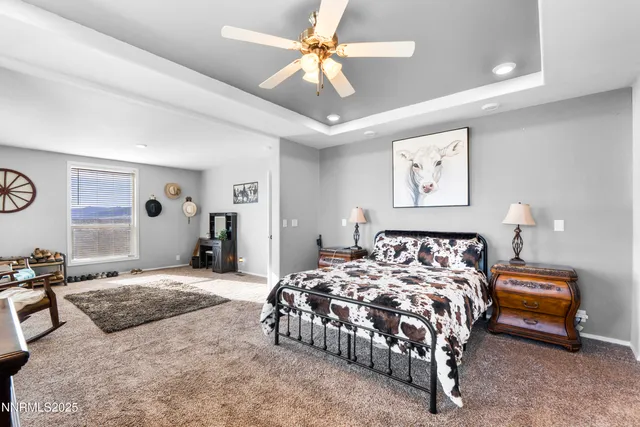 a bedroom with bed and flat screen tv
