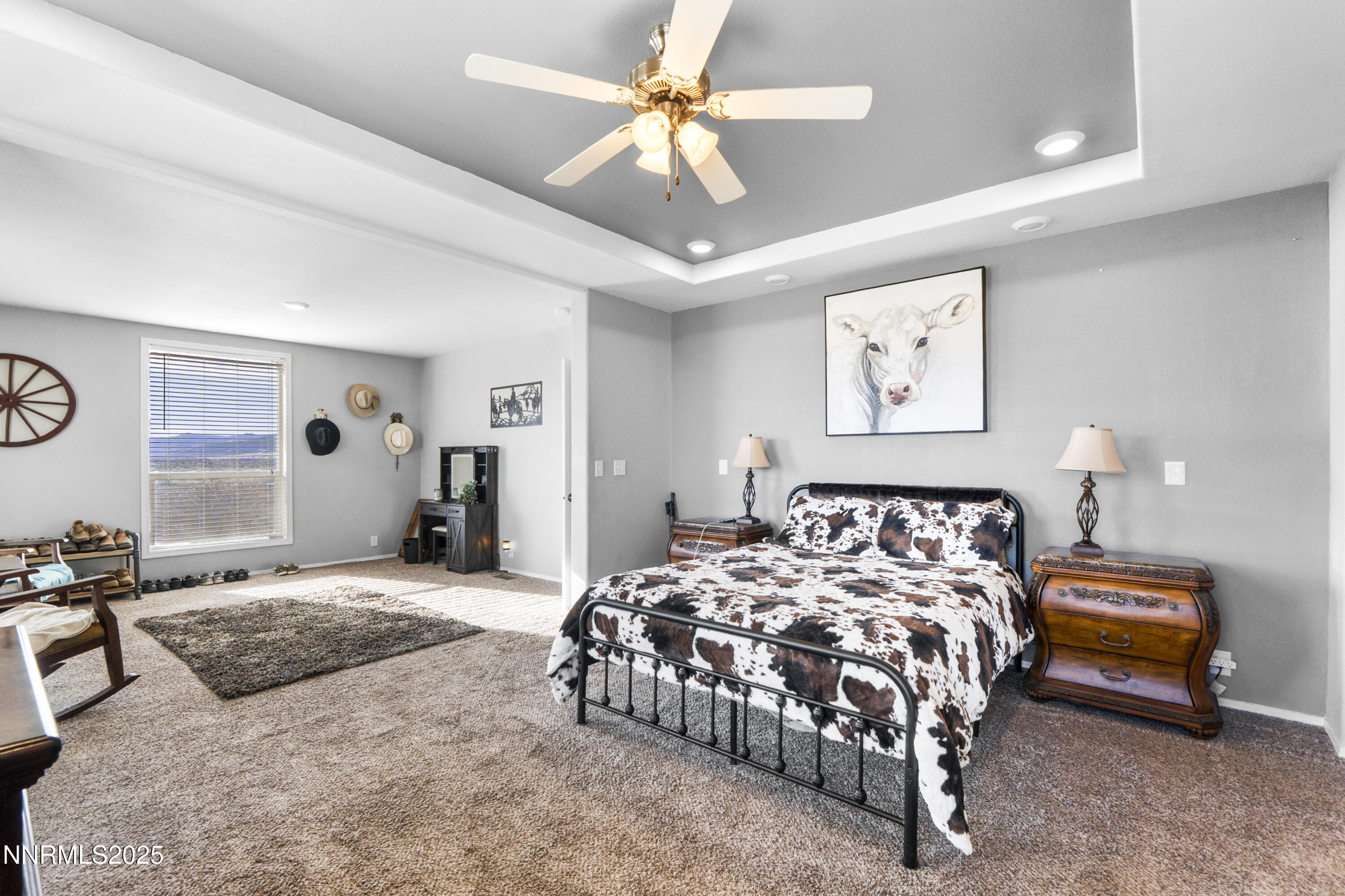 6745 Country Road Winnemucca, NV 89445 - Photo 41 of 50 a bedroom with a large bed and a chandelier