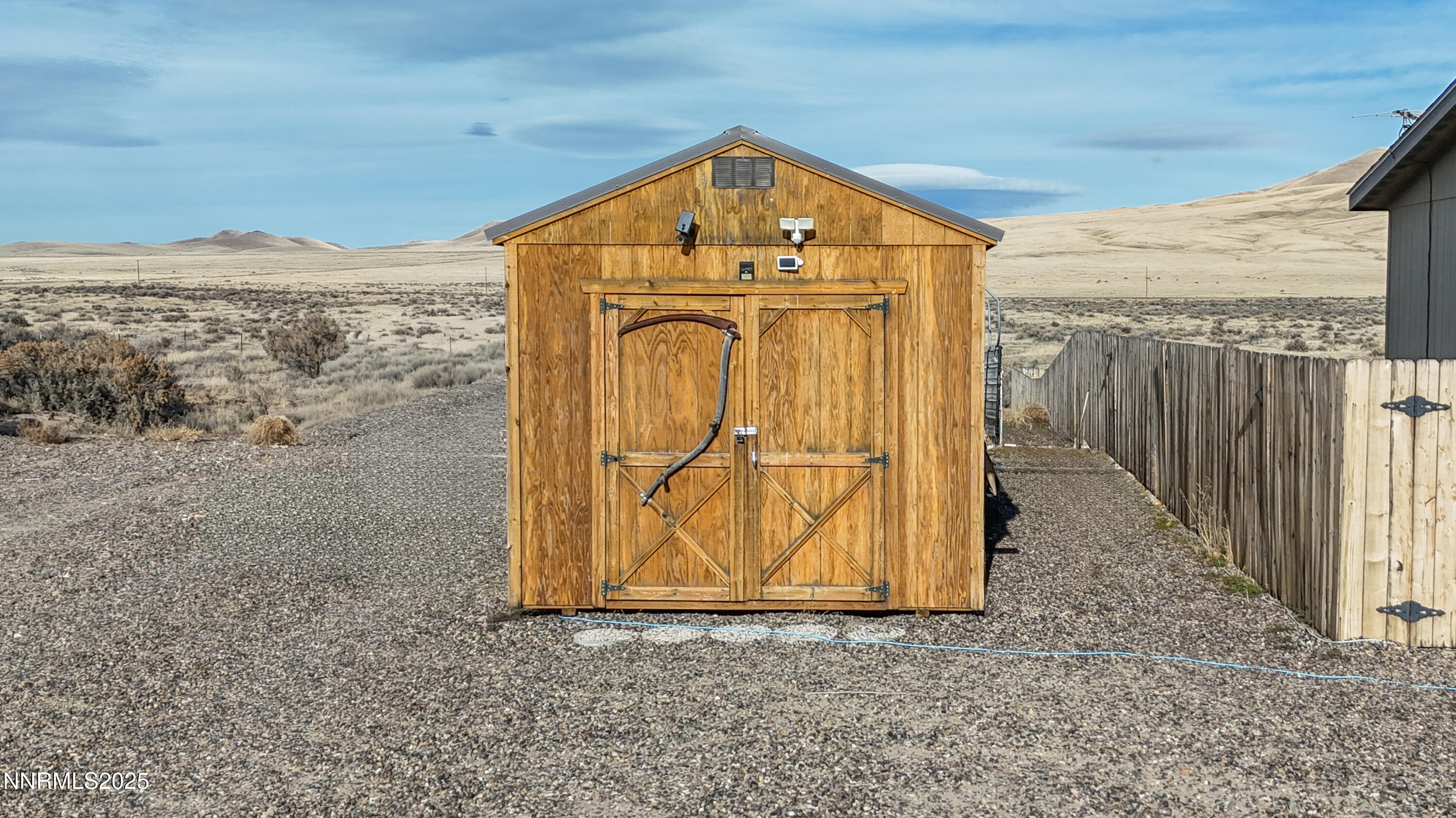 6745 Country Road Winnemucca, NV 89445 - Photo 45 of 50 a view of a wooden door in front of house